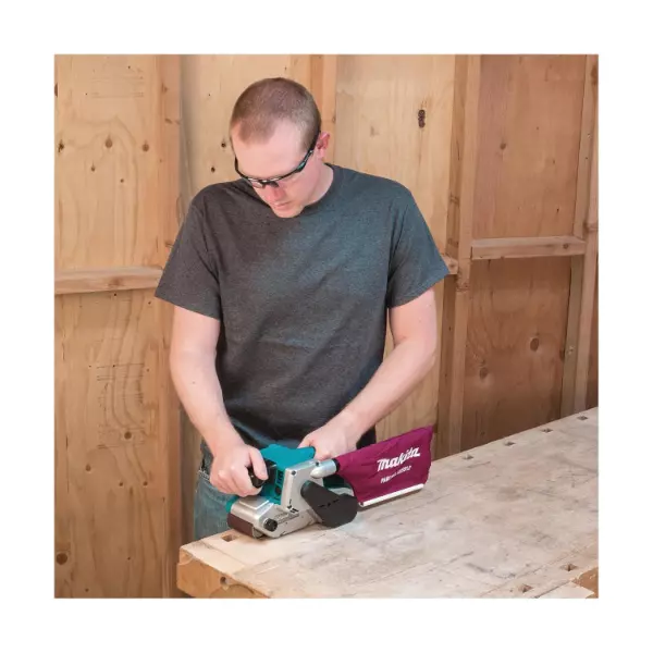 Makita Belt Sander 1010 W Power, 76x553 mm Belt Size and 210-440 m/min Speed With Accessories, 9903